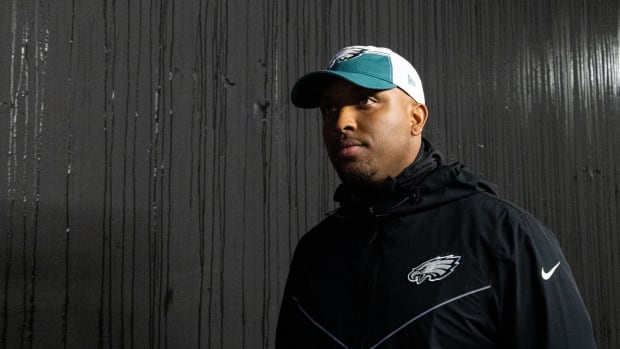 Philadelphia Eagles offensive coordinator Brian Johnson walks out of the tunnel for a game.